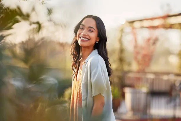 files/portrait-of-beautiful-happy-woman-smiling-during-sunset-outdoor.webp